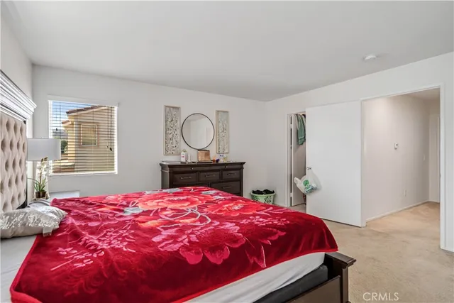 a view of walk in closet with clothes