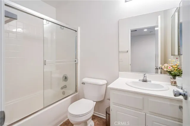 a view of a patio with a table and chairs