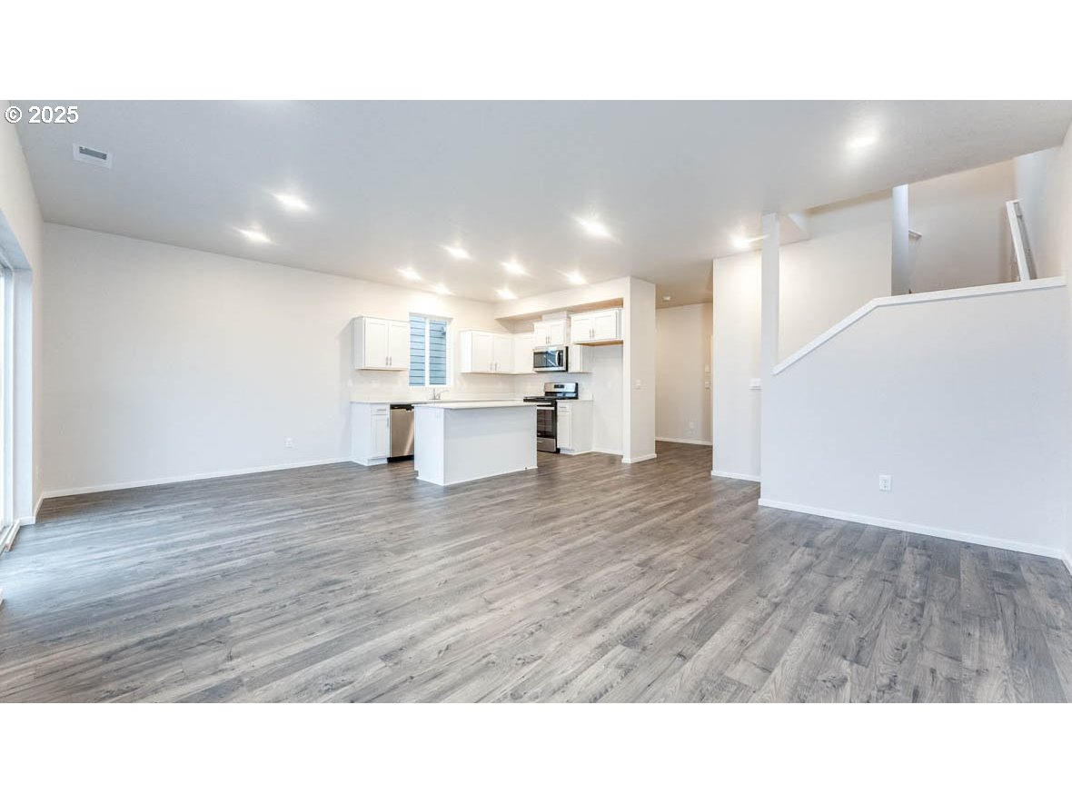 2967 T Street Springfield, OR 97477 - Photo 5 of 27 a living room with kitchen island furniture and wooden floor