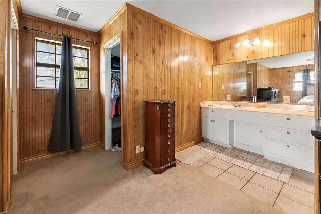 232 South Moseley Street De Leon, TX 76444 - Photo 16 of 39 a view of a kitchen with refrigerator and window