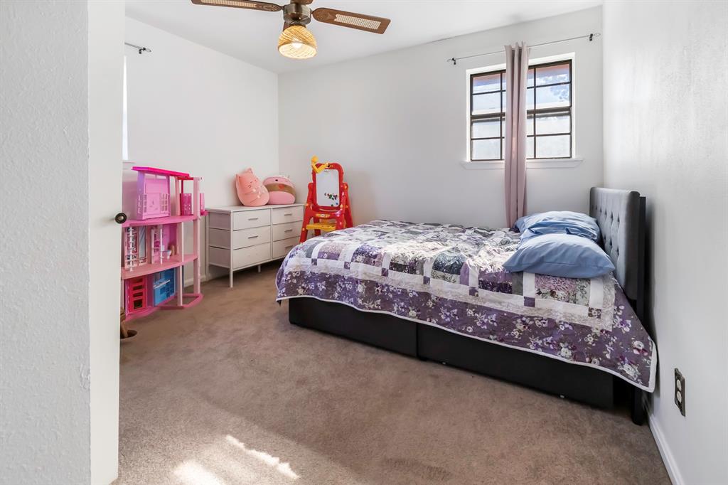 232 South Moseley Street De Leon, TX 76444 - Photo 19 of 39 a bedroom with a bed and window