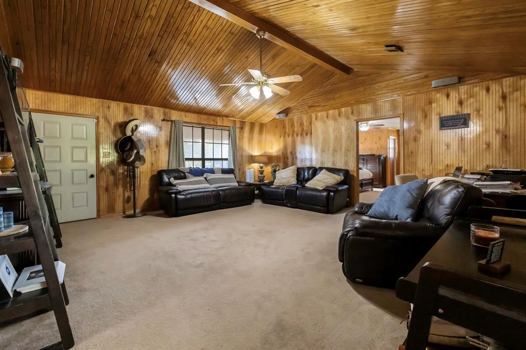 232 South Moseley Street De Leon, TX 76444 - Photo 5 of 39 a living room with furniture and a gym machine