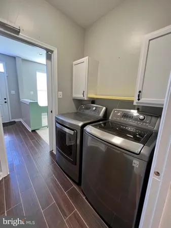 a utility room with washer and dryer