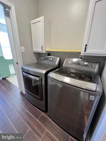 a utility room with washer and dryer