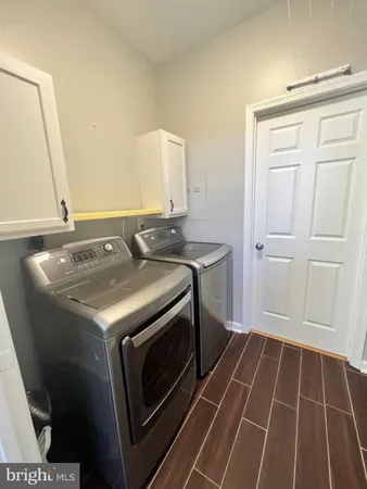 a utility room with washer and dryer