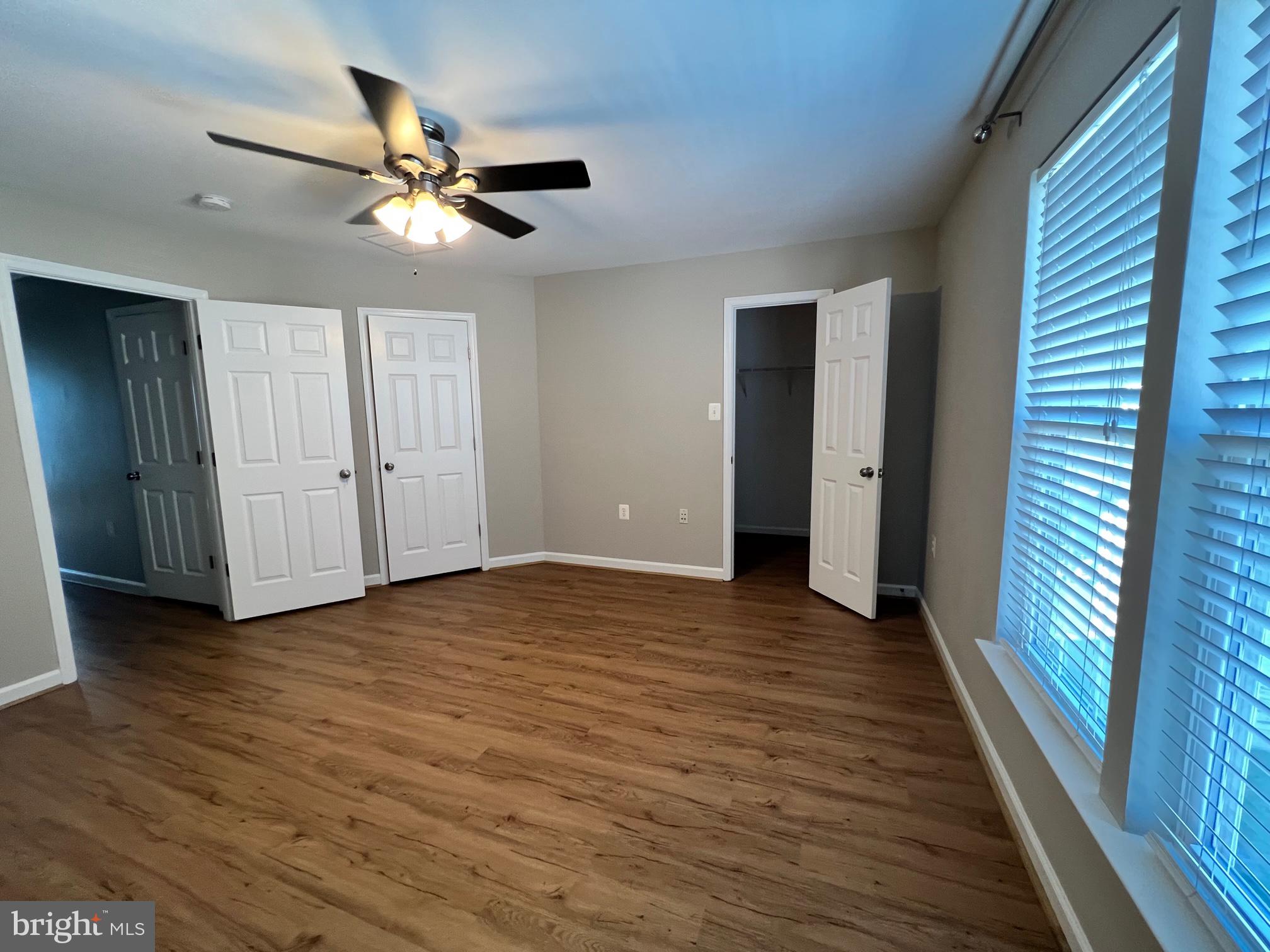 66 Davis Street Charles Town, WV 25414 - Photo 21 of 45 a view of an empty room with wooden floor and a ceiling fan