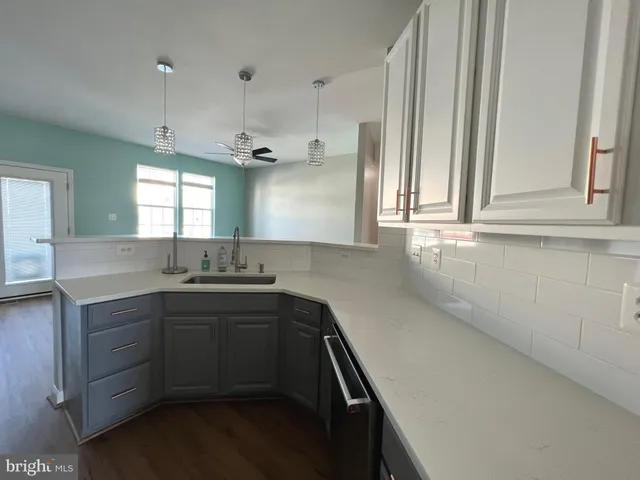 a kitchen with sink cabinets and window