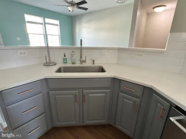 a kitchen with a sink and cabinets