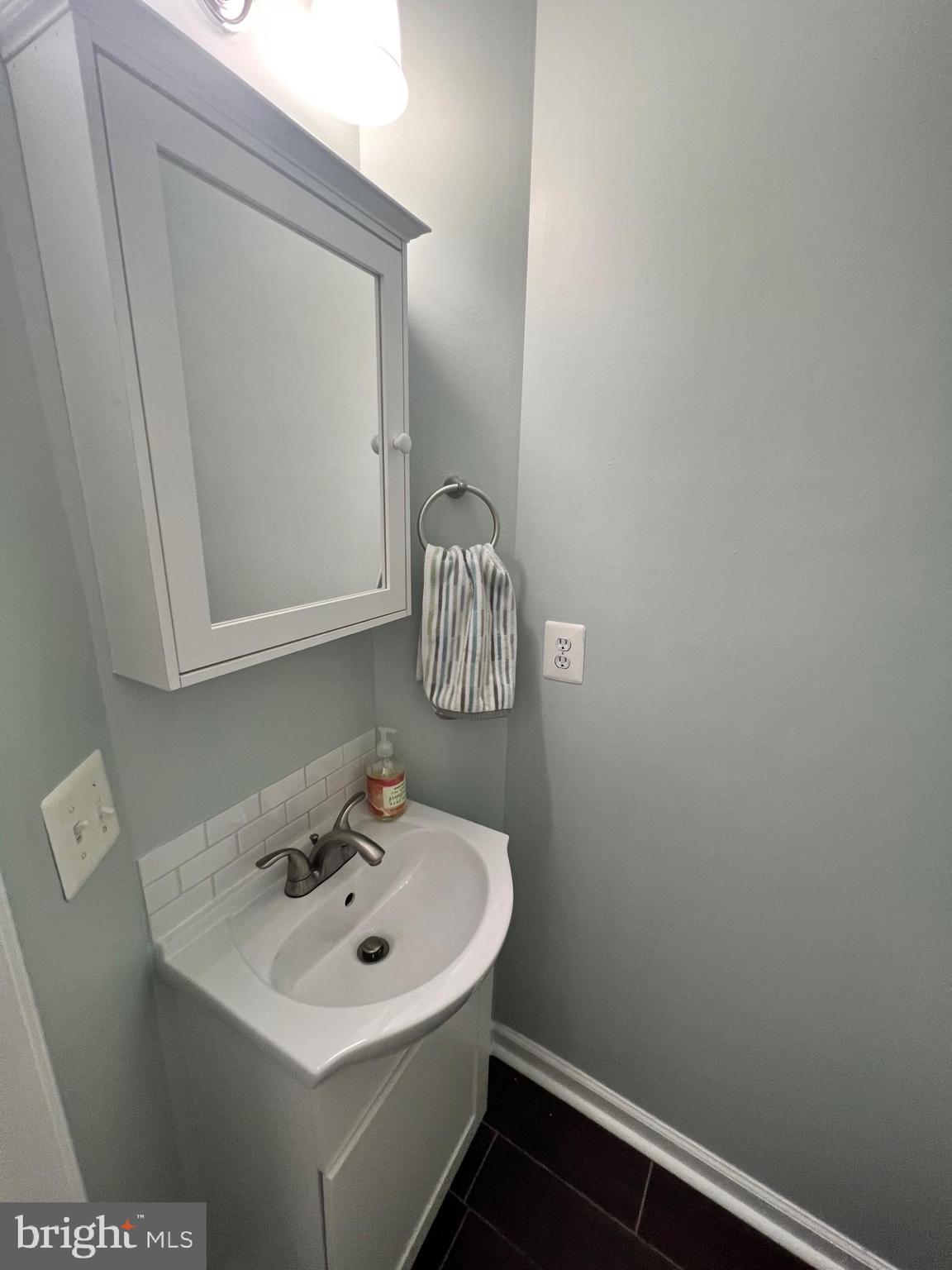 66 Davis Street Charles Town, WV 25414 - Photo 45 of 45 a bathroom with a sink and a mirror