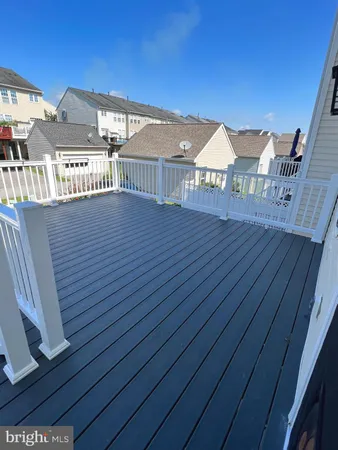 a view of a balcony with wooden floor