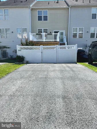a view of an empty room with a kitchen