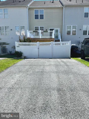 a view of an empty room with a kitchen