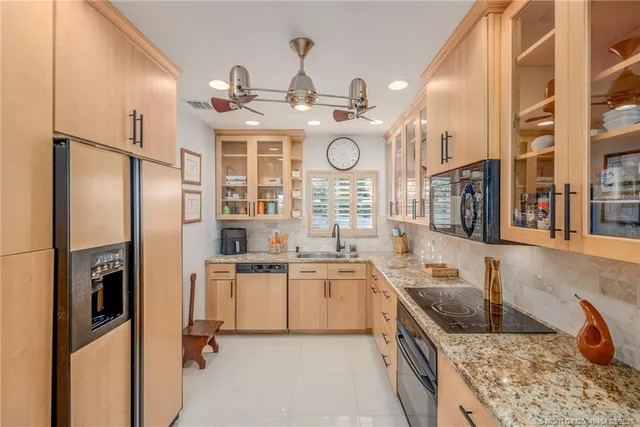 a spacious bedroom with a bed and a window