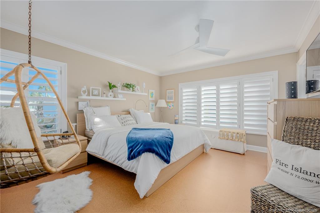 3901 Southeast St Lucie Boulevard, Unit 39 Stuart, FL 34997 - Photo 17 of 70 a spacious bedroom with a bed and a window