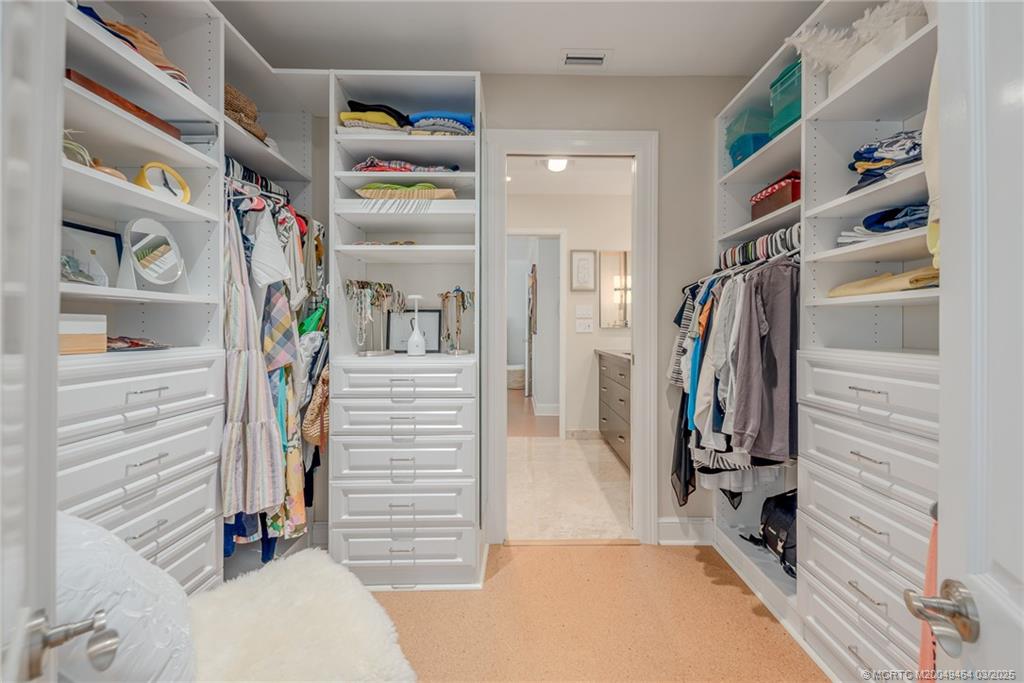 3901 Southeast St Lucie Boulevard, Unit 39 Stuart, FL 34997 - Photo 21 of 70 a view of walk in closet with clothes and shoes