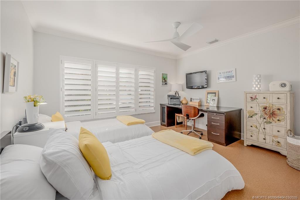 3901 Southeast St Lucie Boulevard, Unit 39 Stuart, FL 34997 - Photo 23 of 70 a bedroom with a bed and furniture