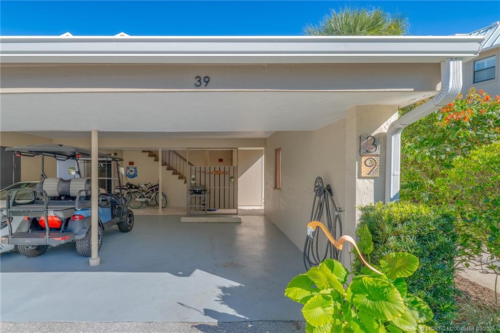 3901 Southeast St Lucie Boulevard, Unit 39 Stuart, FL 34997 - Photo 27 of 70 a living room with furniture and a potted plant