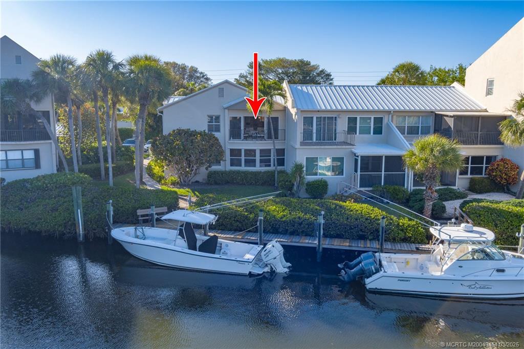 3901 Southeast St Lucie Boulevard, Unit 39 Stuart, FL 34997 - Photo 33 of 70 a view of a house with swimming pool and sitting area