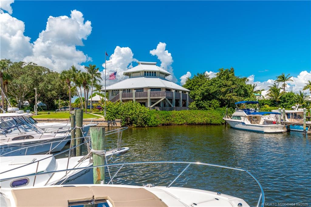3901 Southeast St Lucie Boulevard, Unit 39 Stuart, FL 34997 - Photo 55 of 70 a swimming pool with outdoor seating and yard