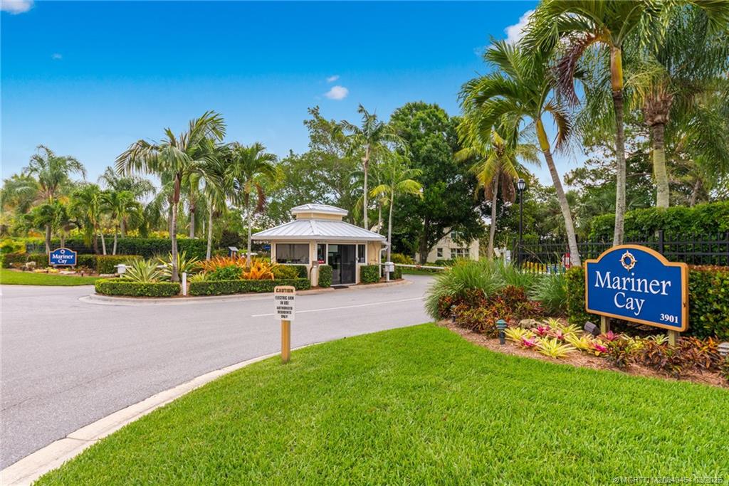 3901 Southeast St Lucie Boulevard, Unit 39 Stuart, FL 34997 - Photo 59 of 70 a view of a park with a bench and plants