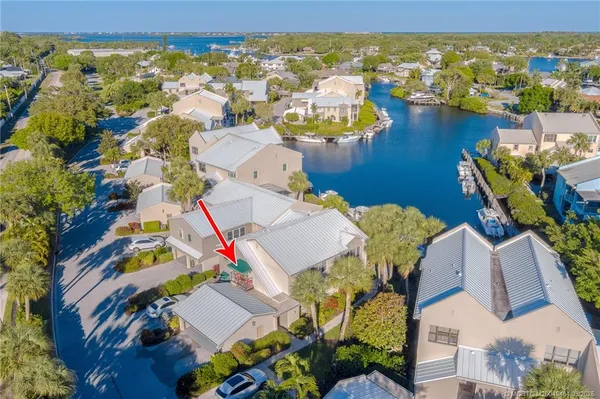 a kitchen with stainless steel appliances granite countertop a refrigerator a oven and a sink with cabinets