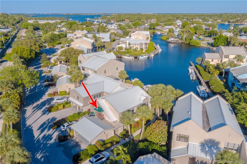 3901 Southeast St Lucie Boulevard, Unit 39 Stuart, FL 34997 - Photo 7 of 70 an aerial view of residential houses with outdoor space and swimming pool