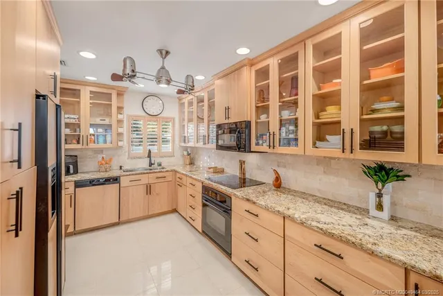 a bathroom with a large mirror and a shower