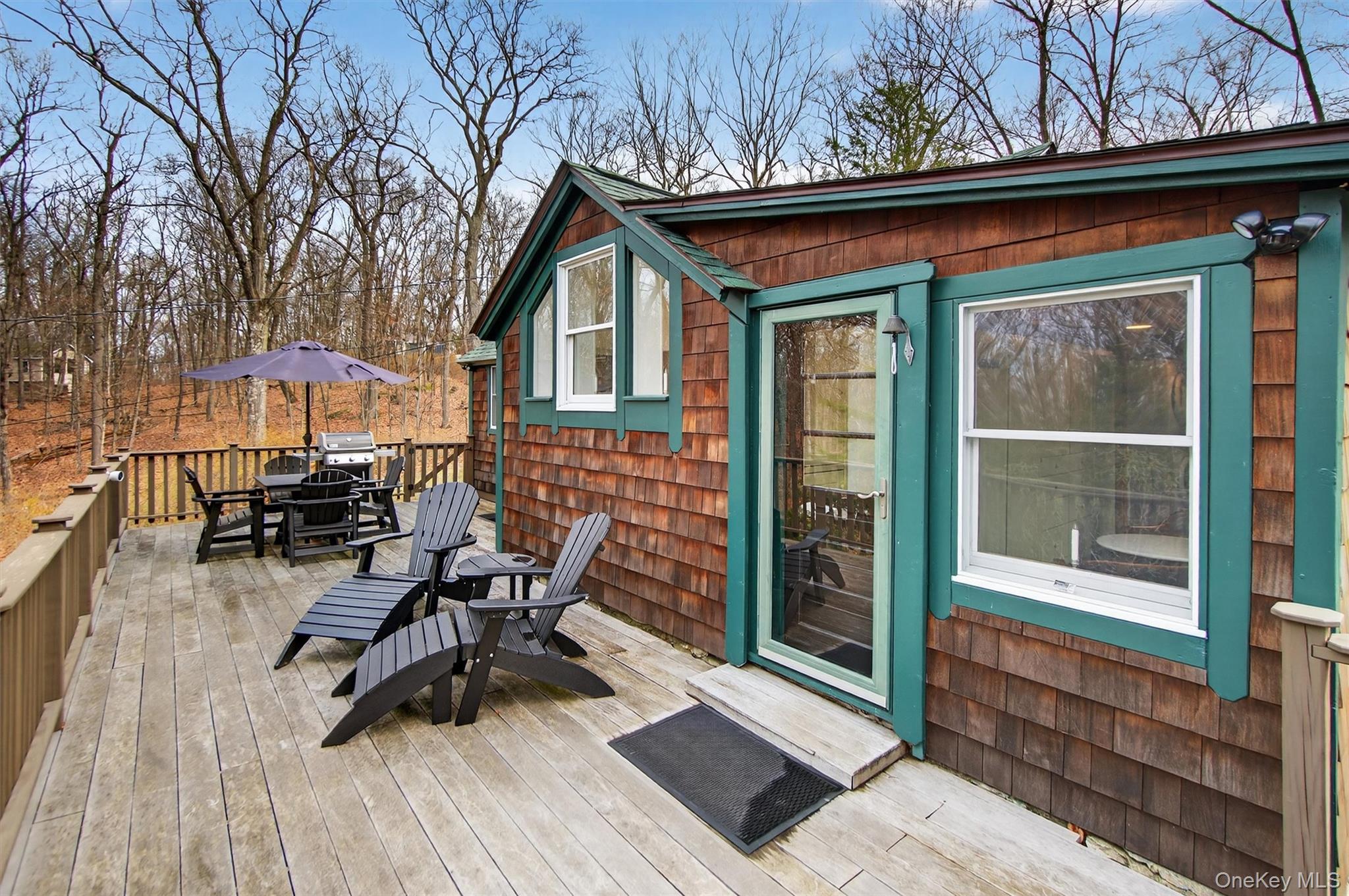 Wooden deck featuring outdoor dining area