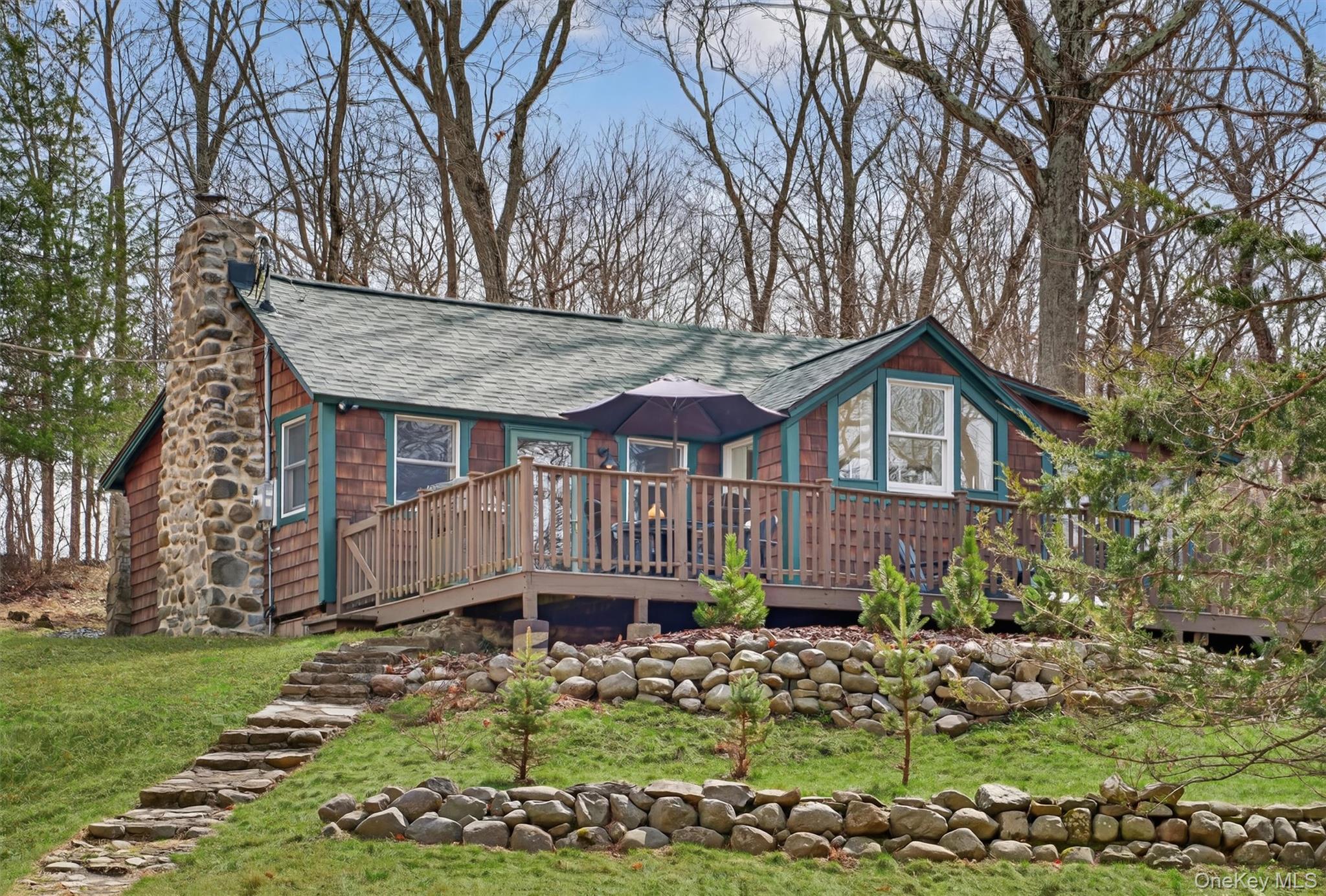 58 Oxford Springs Road Chester, NY 10918 - Photo 2 of 38 View of front of home featuring a deck, a chimney, and a front yard