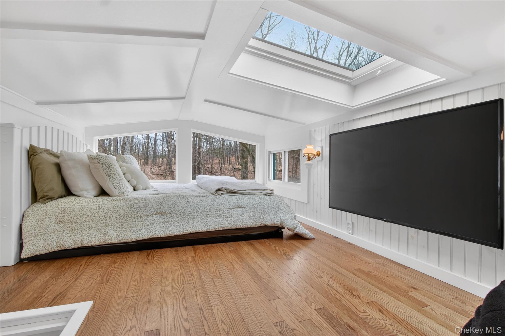 58 Oxford Springs Road Chester, NY 10918 - Photo 26 of 38 Loft featuring a skylight, light wood-type flooring, and lofted ceiling