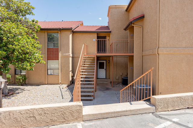 Multi-level stucco exterior with tile roofing