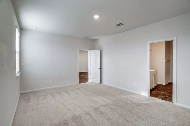 a view of an empty room and closet