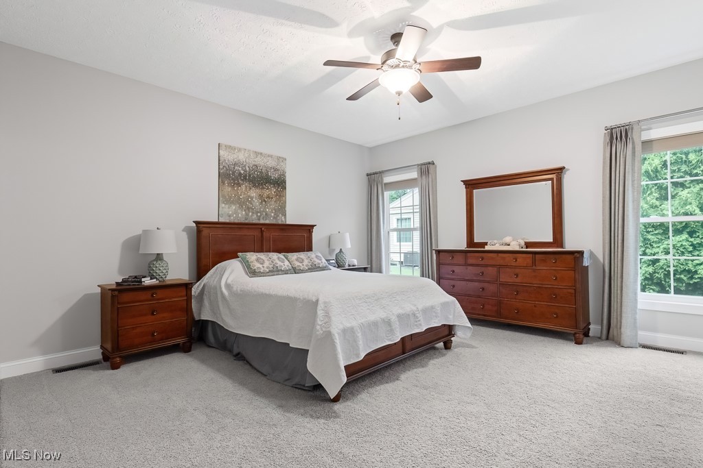 369 Eldridge Road Aurora, OH 44202 - Photo 14 of 50 Bedroom featuring light carpet and a ceiling fan
