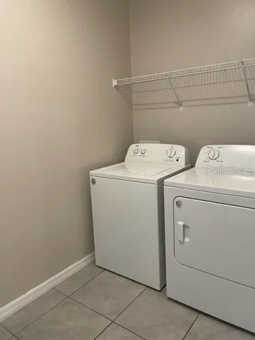 a view of the house with a yard