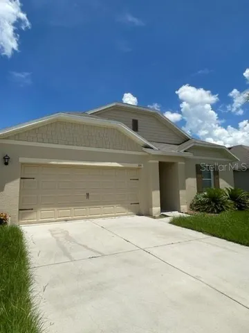 a view of a house with a garden