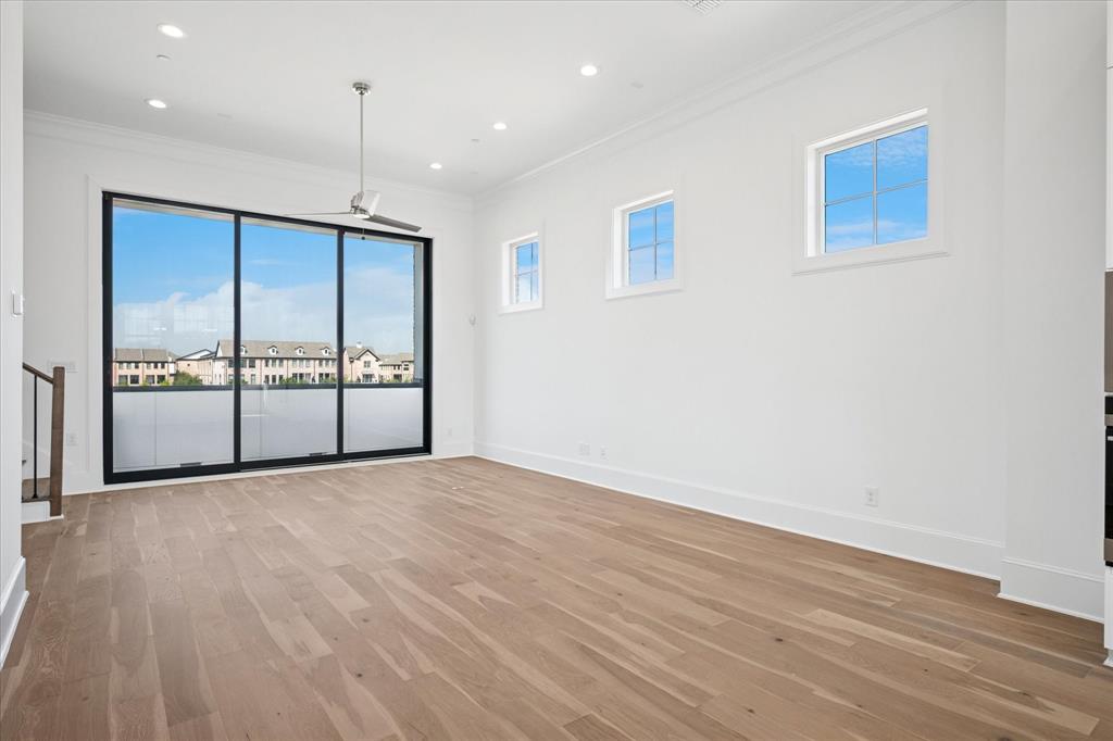 6011 Laurel Lane Addison, TX 75001 - Photo 28 of 33 a view of an empty room with wooden floor and a window