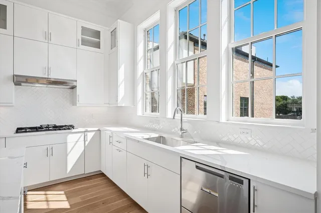 a view of a patio with table and chairs and potted plants