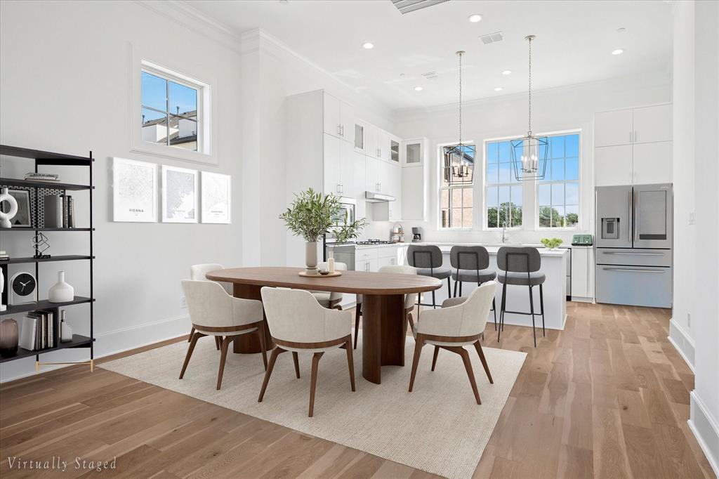 6011 Laurel Lane Addison, TX 75001 - Photo 5 of 33 a view of a dining room with furniture and wooden floor