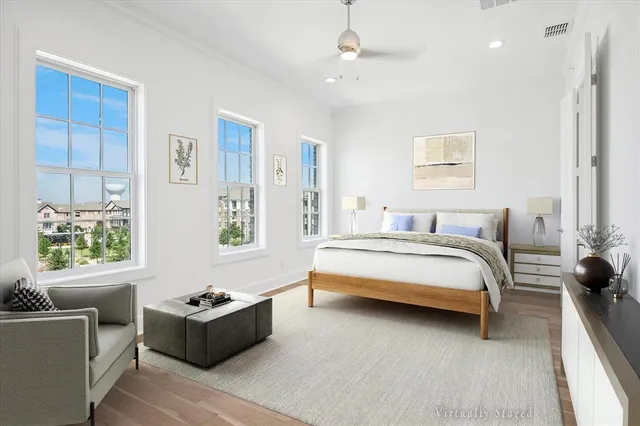 a bedroom with a bed and a couch