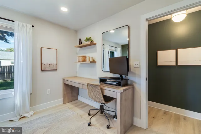 a workspace with furniture and window