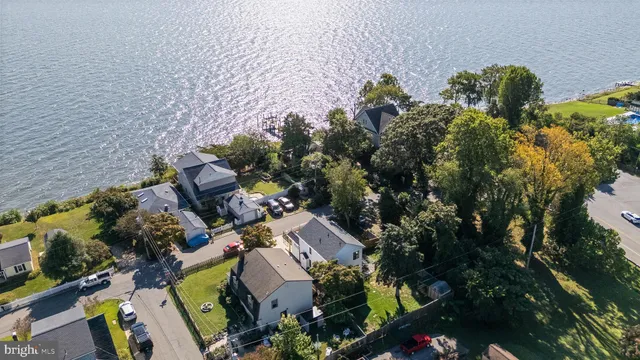 an aerial view of a house with a yard basket ball court and outdoor seating