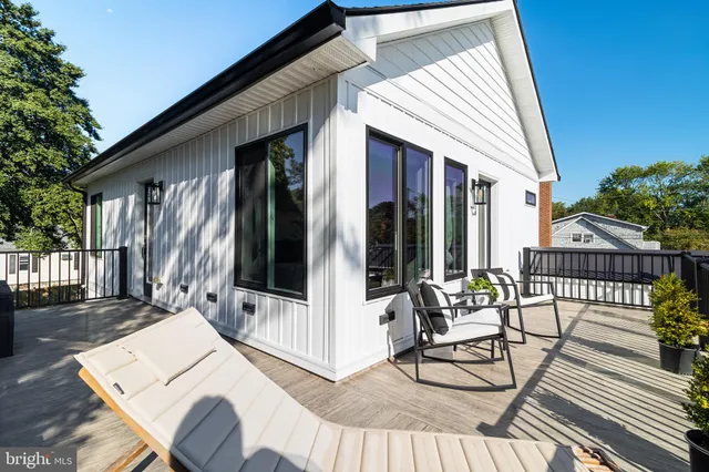 a view of a patio with a table and chairs