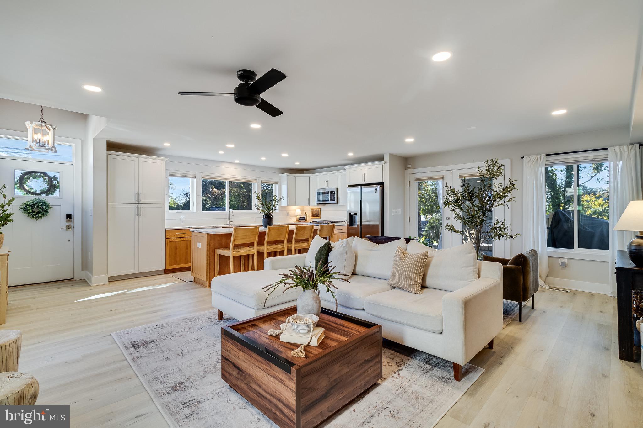 84 Chesapeake Avenue Prince Frederick, MD 20678 - Photo 3 of 42 a living room with furniture kitchen view and a large window