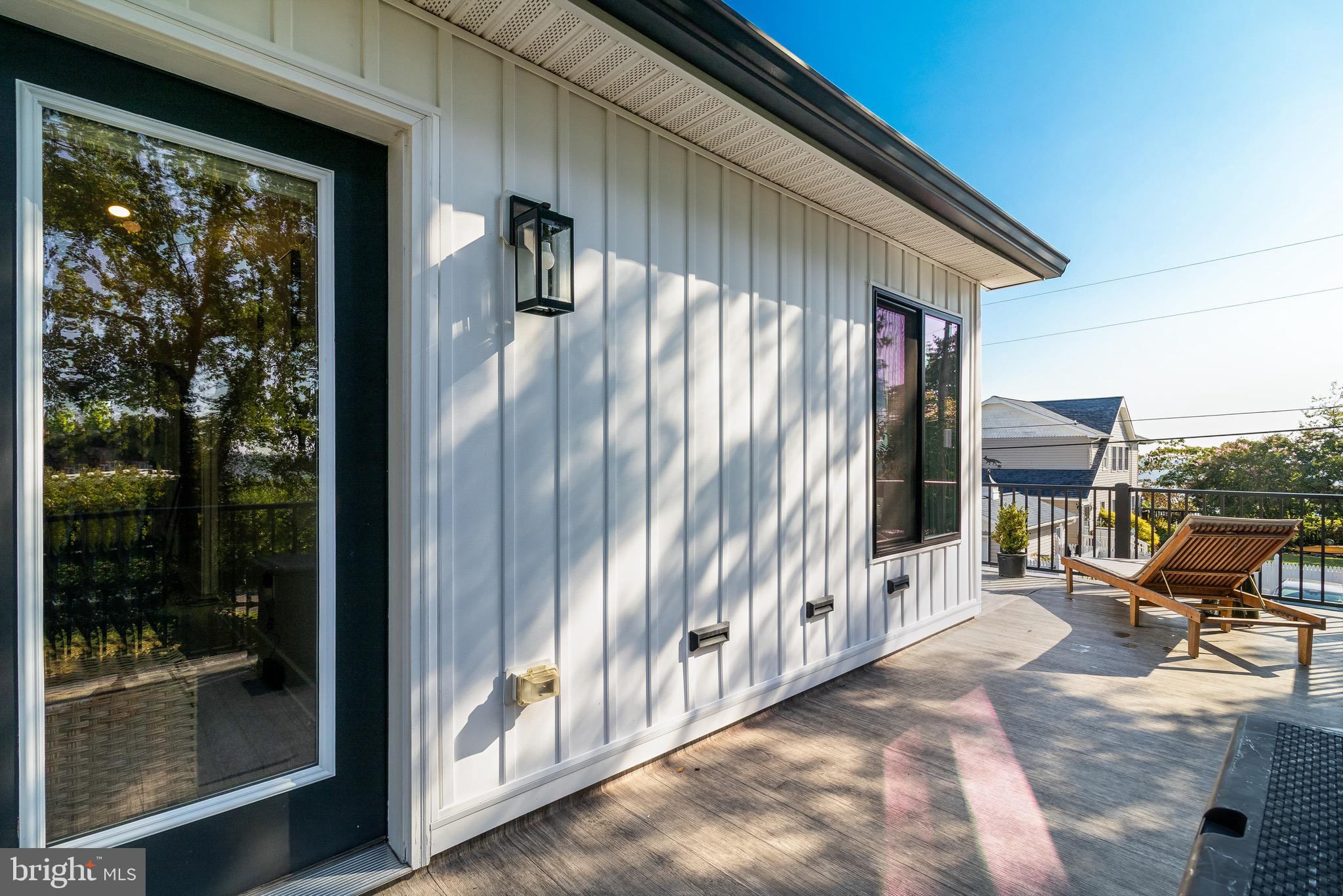84 Chesapeake Avenue Prince Frederick, MD 20678 - Photo 36 of 42 a backyard of a house with table and chairs