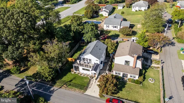 an aerial view of residential houses with outdoor space