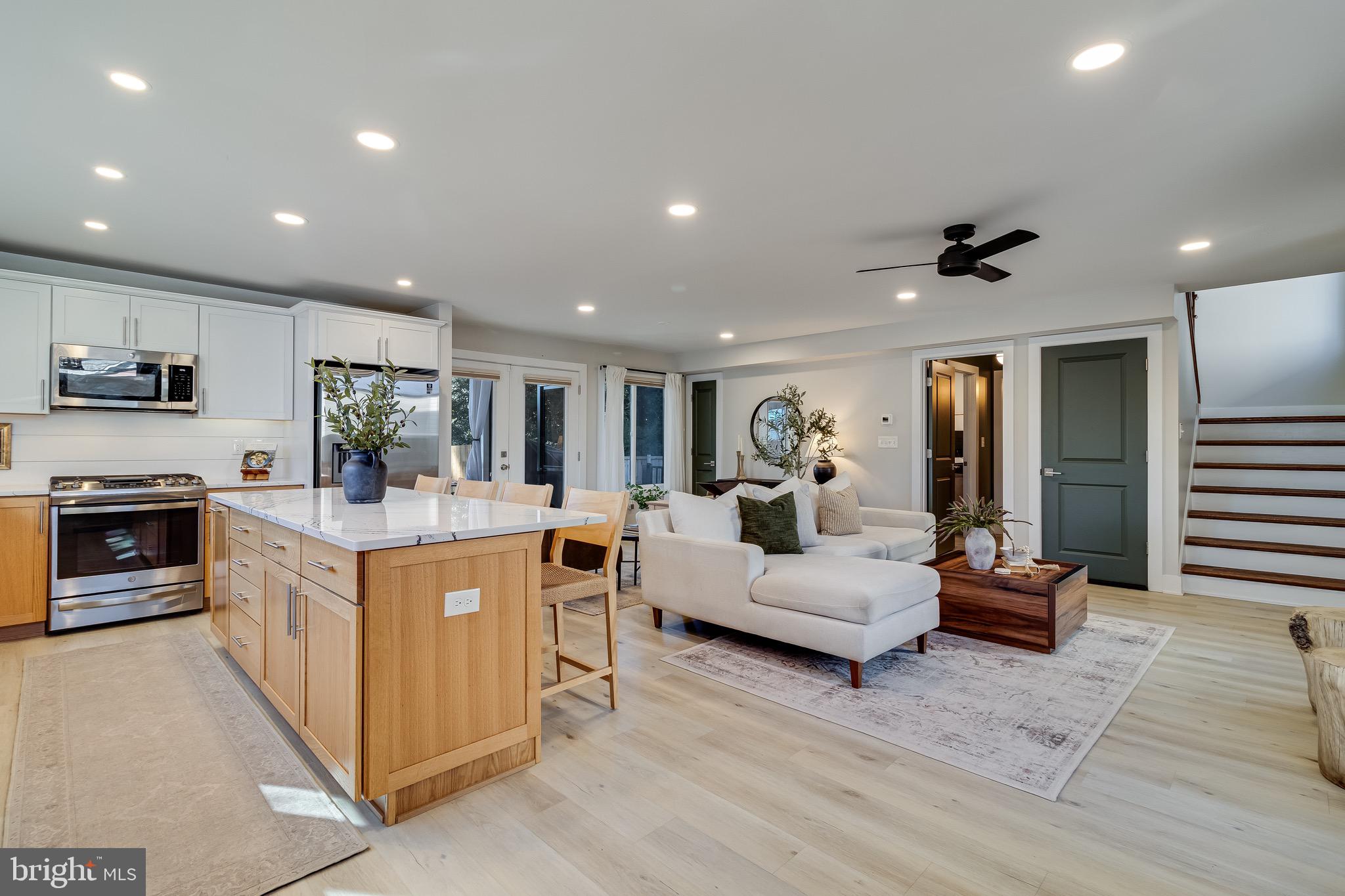 84 Chesapeake Avenue Prince Frederick, MD 20678 - Photo 5 of 42 a living room with stainless steel appliances kitchen island furniture and a view of kitchen