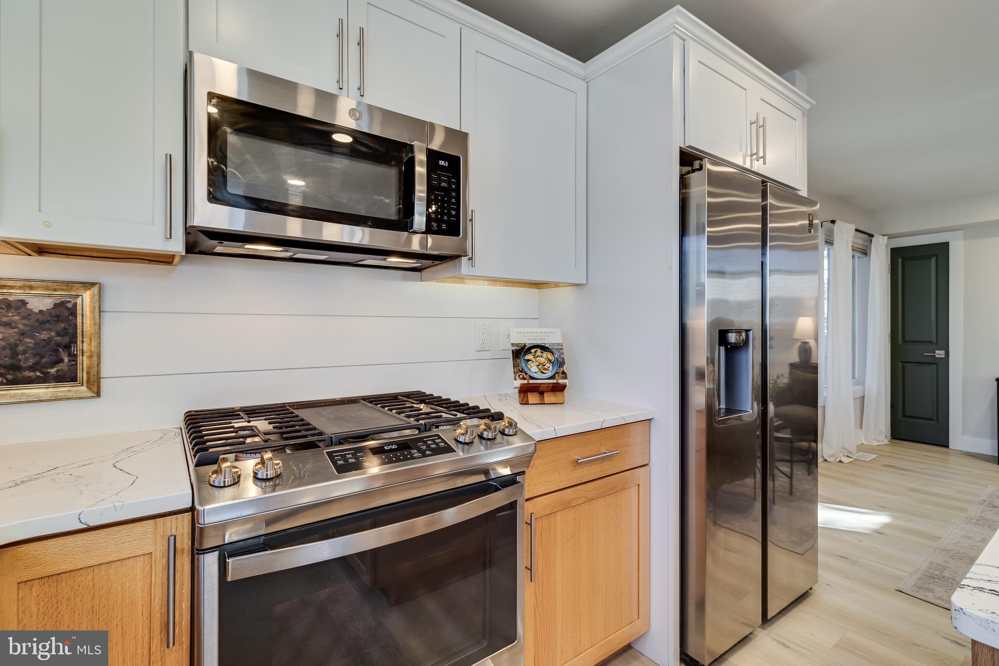 84 Chesapeake Avenue Prince Frederick, MD 20678 - Photo 8 of 42 a kitchen with a stove and a microwave