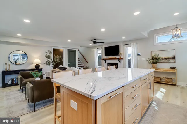 a large kitchen with a table and chairs