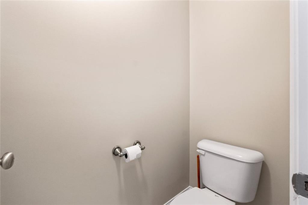 241 Red Bud Road Jefferson, GA 30549 - Photo 30 of 43 a white toilet sitting next to a white wall