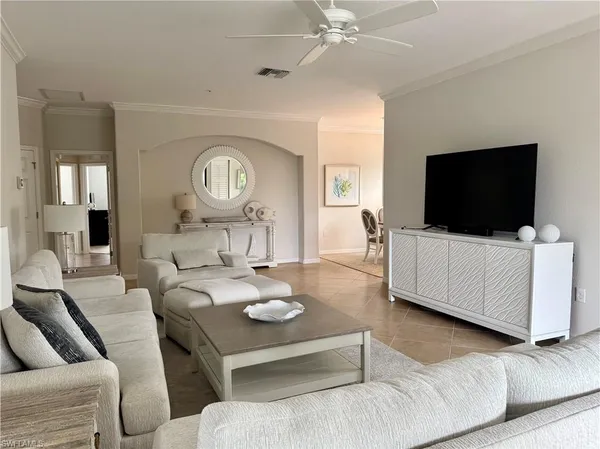 a view of a livingroom with furniture and a flat screen tv